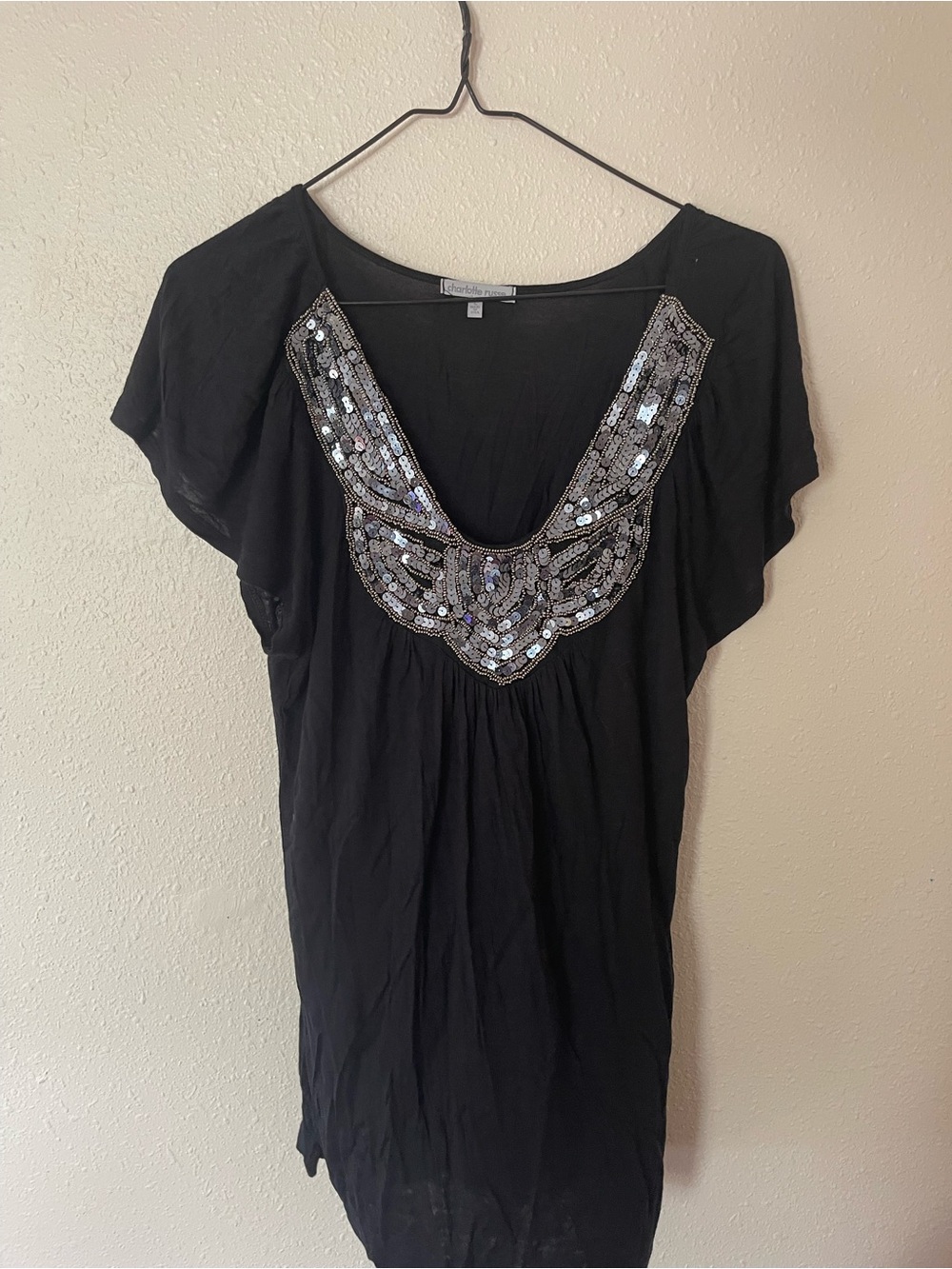 Charolette Russe black blouse with silver sequin embellishment on neckline